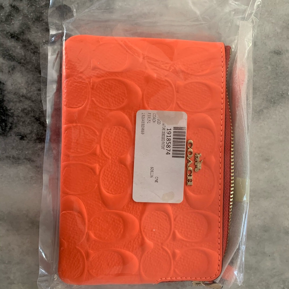 Orange patent coach wristlet/change purse